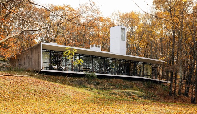Modern Architectural Concept House nestled into Nature