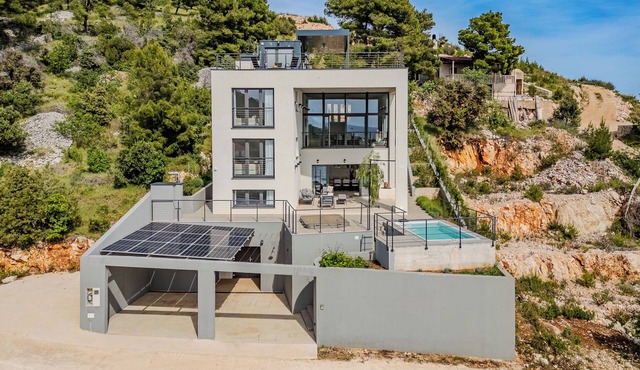 Modern beachfront villa in exceptional seculed bay with pool