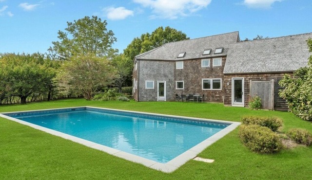 Modern Bridgehampton retreat w expansive yard, heated pool, close to town.