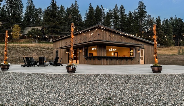 Modern cabin on 10 creek front acres with large gas fire pit.