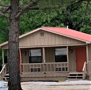 Modern Cabin with Gorgeous Wood Paneled Walls Nestled in the Scenic Beauty of the Ozarks