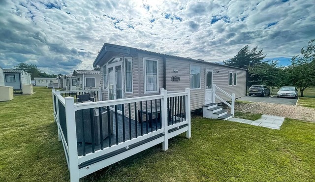 Modern caravan at Caldecott Hall with decking in Norfolk, sleeps 8 ref 91068C