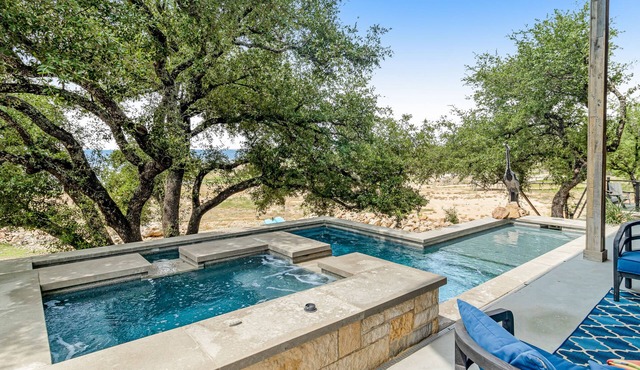Modern charmer with gleaming lake views, pool, fireplace, & grill - dog-friendly