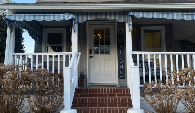 Modern Colonial with lemonade porch and backyard oasis with in-ground heated spa