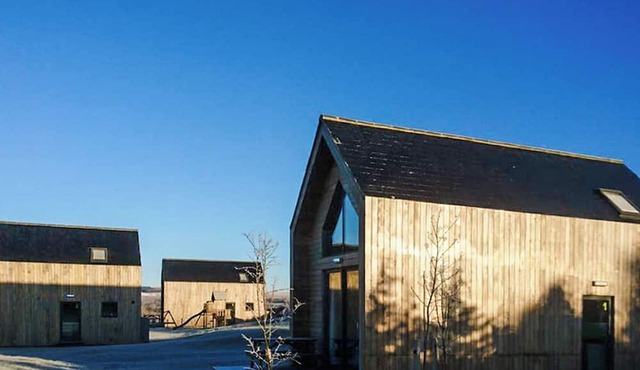 Modern comfort meets rugged wilderness at Tarset Tor’s unique glamping retreat.