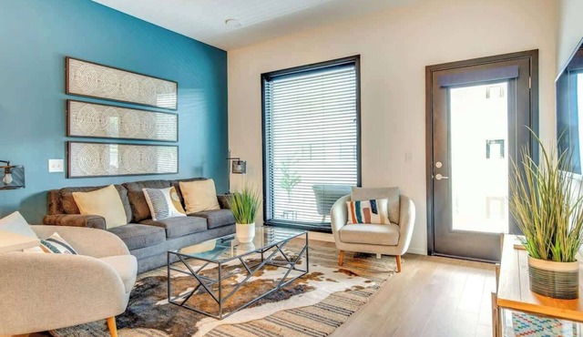Modern condo near attractions with outdoor pool, balcony, central AC, and WiFi