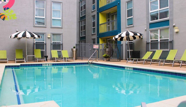 Modern Condo With Pool, Gym, Workspaces & BBQ