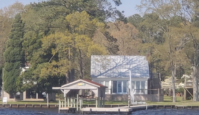 Modern Farmhouse Cottage on water with dock