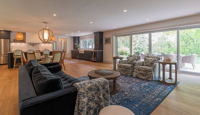 Modern Green Oasis in private setting, covered patio with hot tub and fire pit!