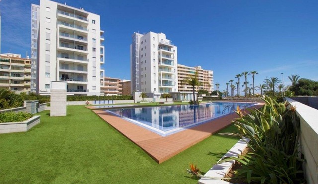 Modern ground floor apartment with 80m² terrace + parking at La Mata beach