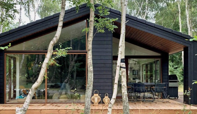 Modern holiday home among old trees in Odden