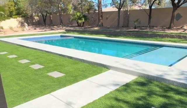 Modern home 12 min from strip, Swimming pool , , enclosed yard, backyard oasis