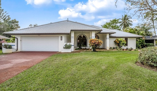 Modern home in great location with private heated pool, lanai & charming patio