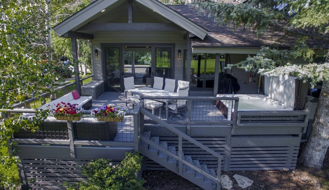 Modern home on creek and golf course with mountain views; ideal 2 families