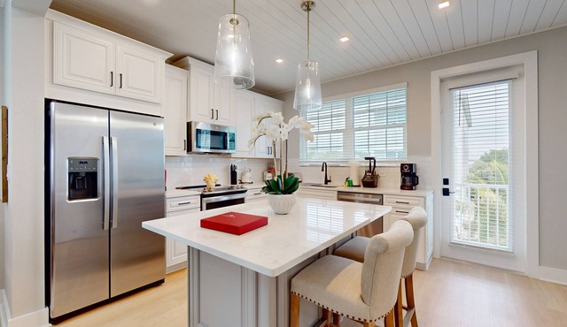 Modern home with screened-in balcony, pool, bikes, & EV charger - great location