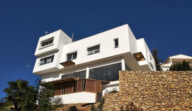 Modern house with indoor pool in urbanization with security service.