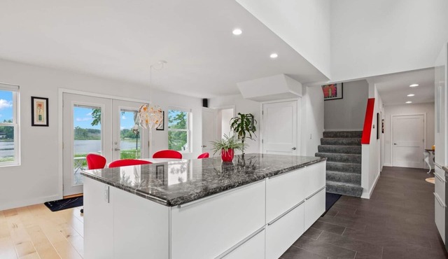 Modern lake house with a double lot. The views are amazing inside and out!n