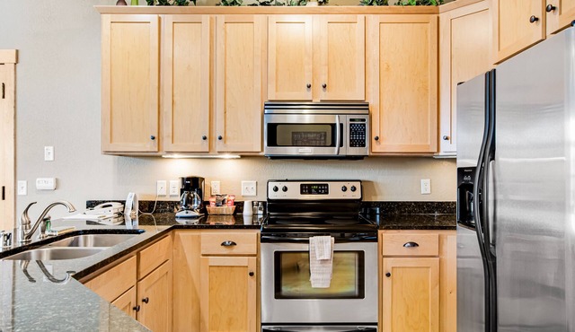 Modern, lake-view condo with loft, balcony, fireplace, pool & hot tub access