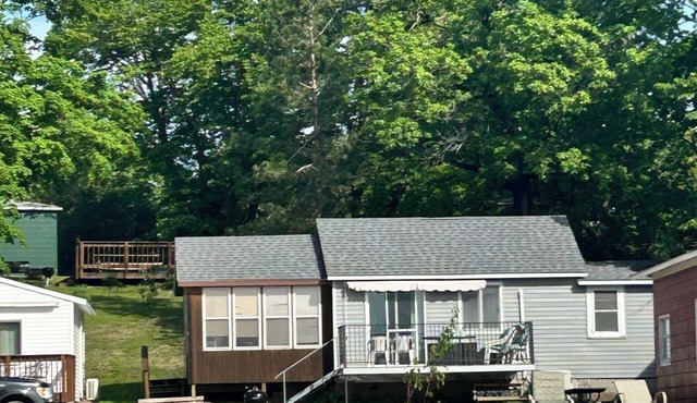 Modern lakeside cabin with panoramic views , deck and screened porch