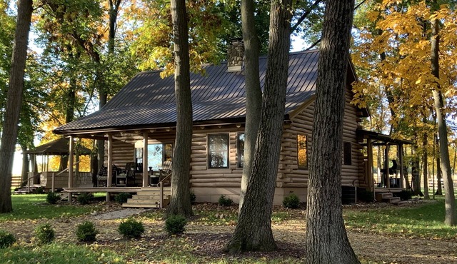 Modern Log Cabin in woods with two gas fireplaces; 20 acres; great location.