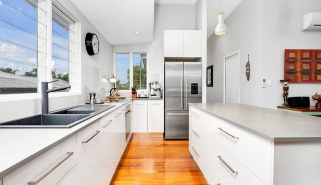 Modern meets Tropical in this Free standing Home