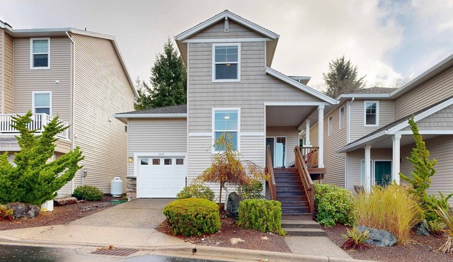 Modern Ocean Highlands home with Netarts Bay and ocean views fireplace dogs OK