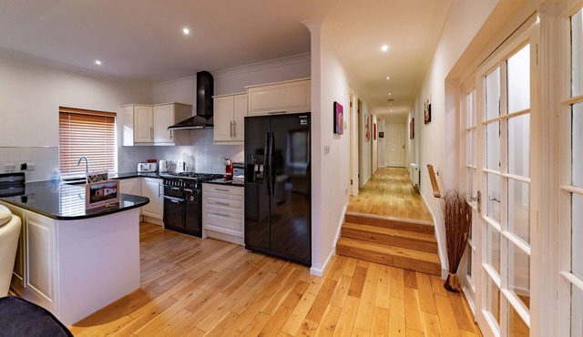 Modern, open, comfortable home within walking distance of Golf courses and beach