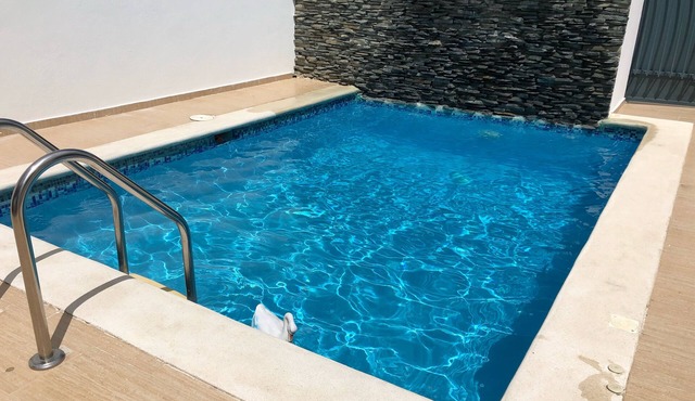 Modern pool house with 24 security gated