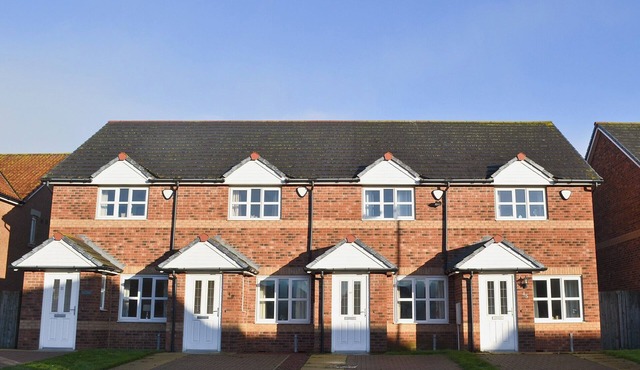 Modern property with an enclosed garden two minutes from a sandy beach.