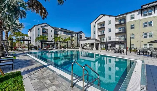 Modern Retreat Near Disney– Balcony Fireworks View King Bed Resort Pool & Gym