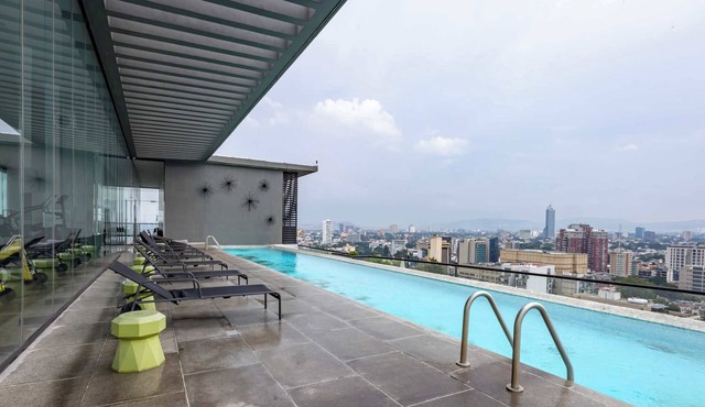 Modern retreat w/pool access & city skyline views