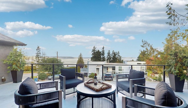 Modern retreat with panoramic ocean views, chef’s kitchen, and gas fireplace