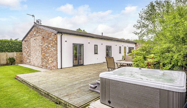 Modern spacious barn conversion with stylish finish.