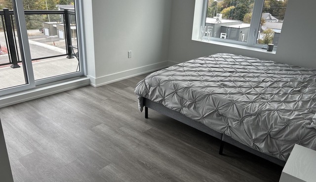Modern, spacious two bedroom condo with a lake view from windows and balcony