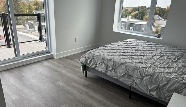 Modern, spacious two bedroom condo with a lake view from windows and balcony