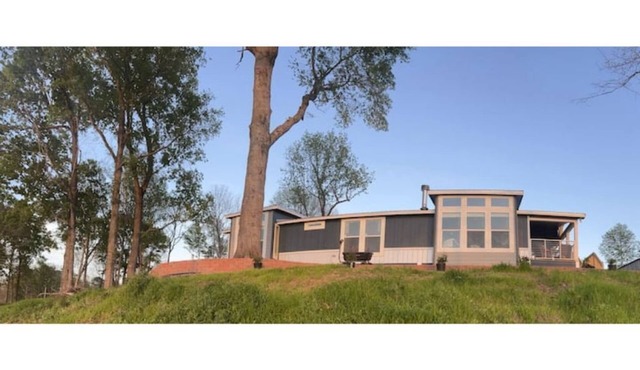 Modern, stylish lake front house. Sweeping views Dedicated boat parking charging