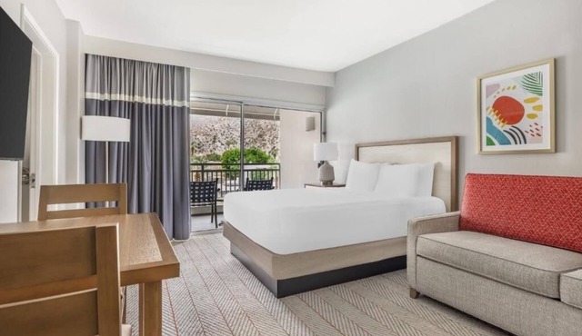 Modern Suite with Private Balcony and Gorgeous Pool Views for Relaxation