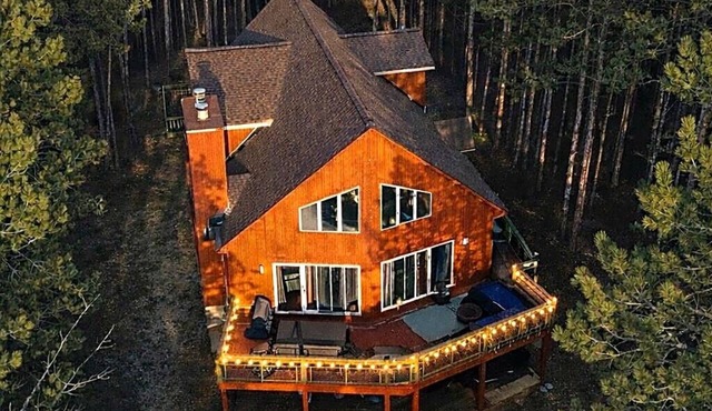 Modern Torch Lake Retreat w Hidden Speakeasy: Golf Sim, Theater, Hot Tub & Games