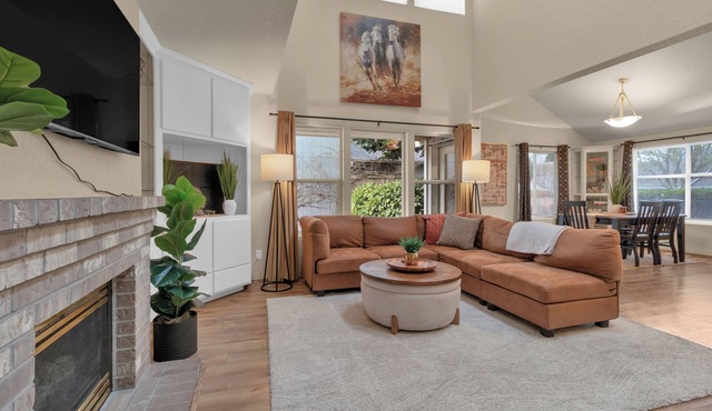 Modern trail-adjacent home with primary suite and fenced yard