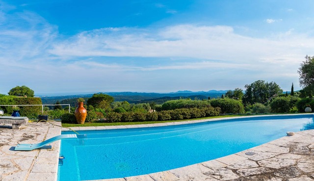 Modern villa in park swimming pool and floodlit tennis court