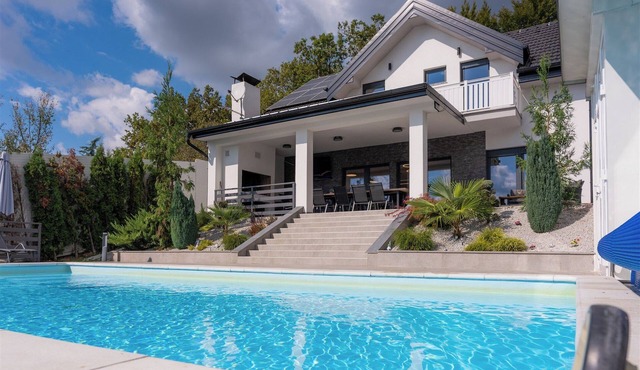 Modern villa with indoor and outdoor pool, sauna and scenic views
