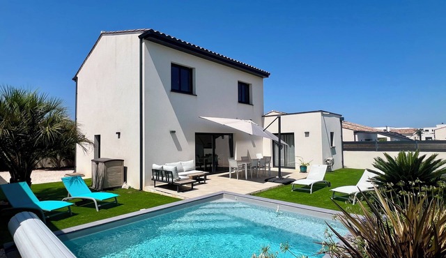 Modern villa with pool near beach and freeway