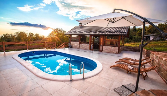 Modern wooden home with pool and spacious yard near the Kupa River.