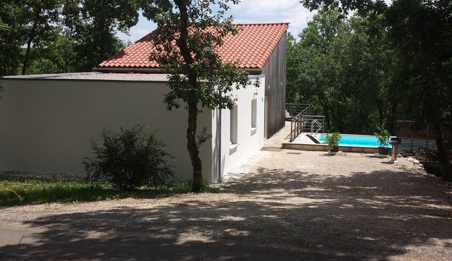 Modern wooden house with tree terrace and private heated pool