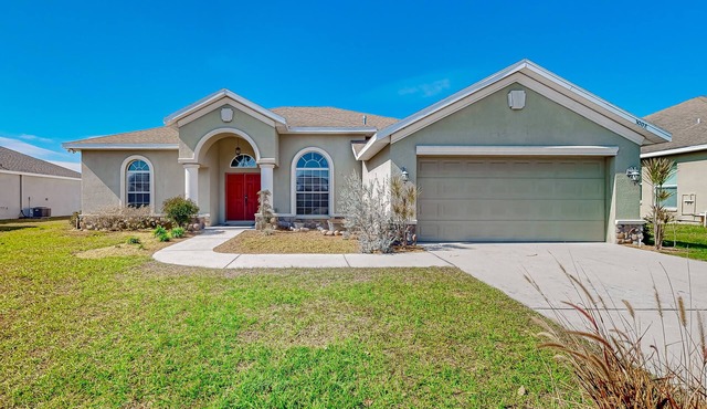 Modernly updated open home with lake view, screened-in patio, grill, AC, & W/D
