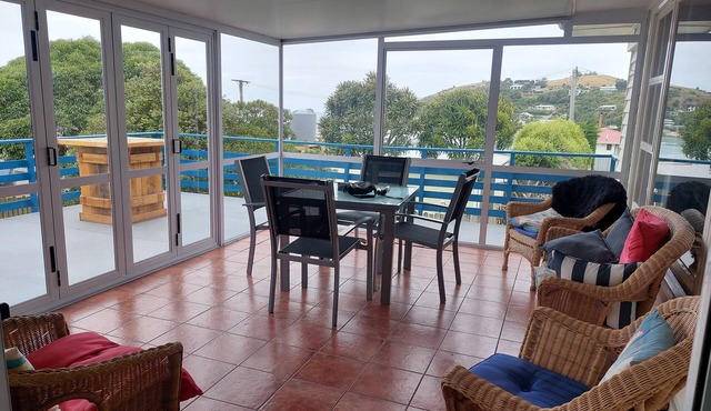 Moeraki village, family sized house stunning views, 50m to the beach.