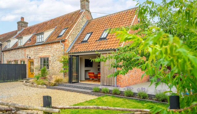 Monarc House is a stunning reimagining of a traditional Norfolk Cottage, tucked away in the heart of