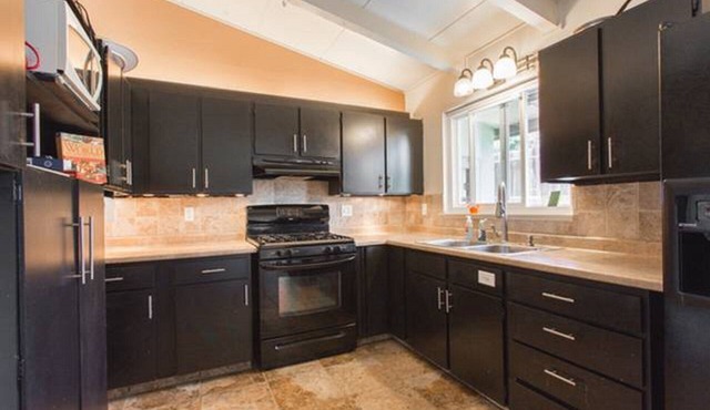 Monterey craftsman style home with vaulted exposed-beams ceiling hardwood floor