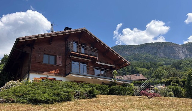 Mountain chalet with pool & stunning views, close to skiing & summer activities.