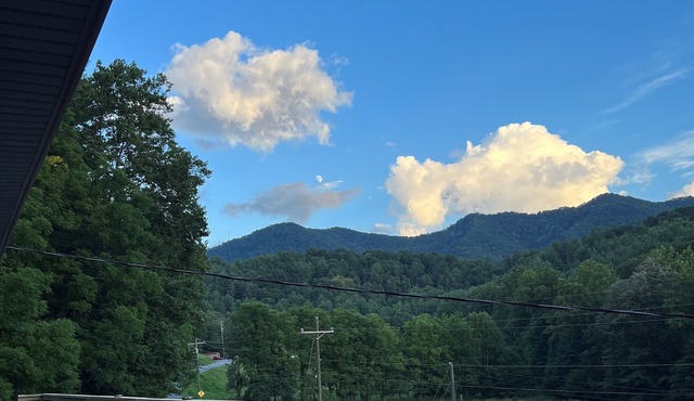 Mountain retreat with large deck with a beautiful mountain view.